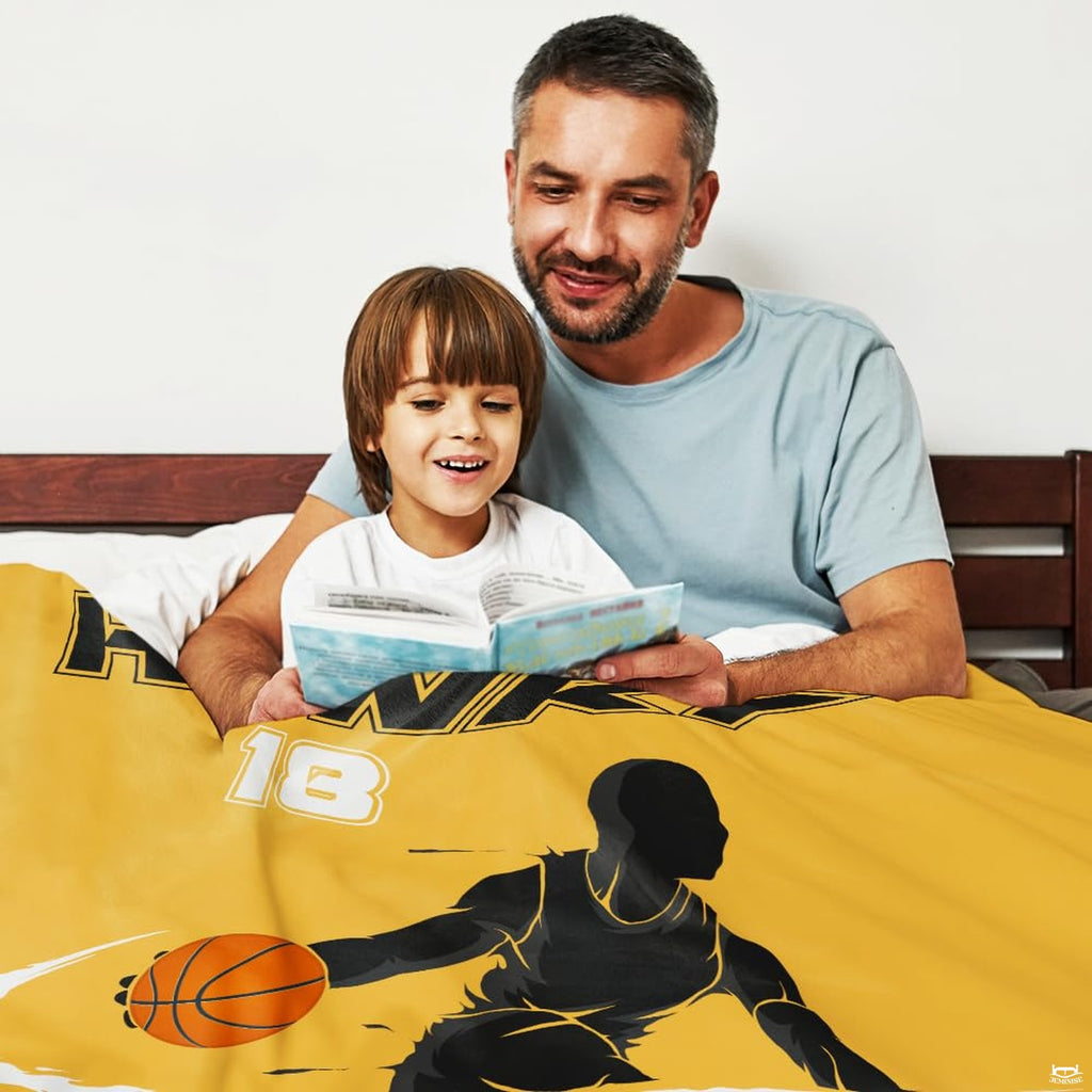 Close-up perspective of orange basketball and speed trail graphic on throw blanket
