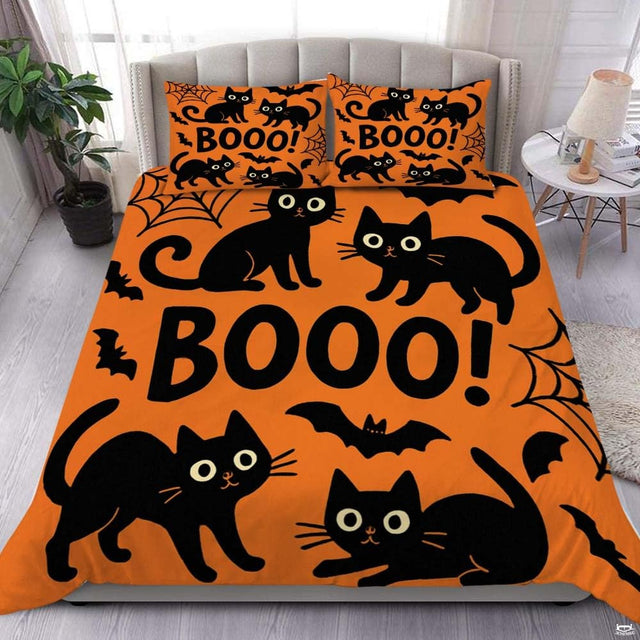 Overhead bedroom view displaying black cats and spider webs Halloween bedding with matching pillowcases.