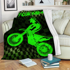 Neon green motocross throw blanket view 2 highlighting dirt bike jumper, checkered flag, and green background