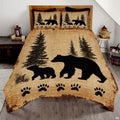 Rustic cabin bed cover showing mother bear and cub silhouettes amid pine trees on vintage tan paper background.