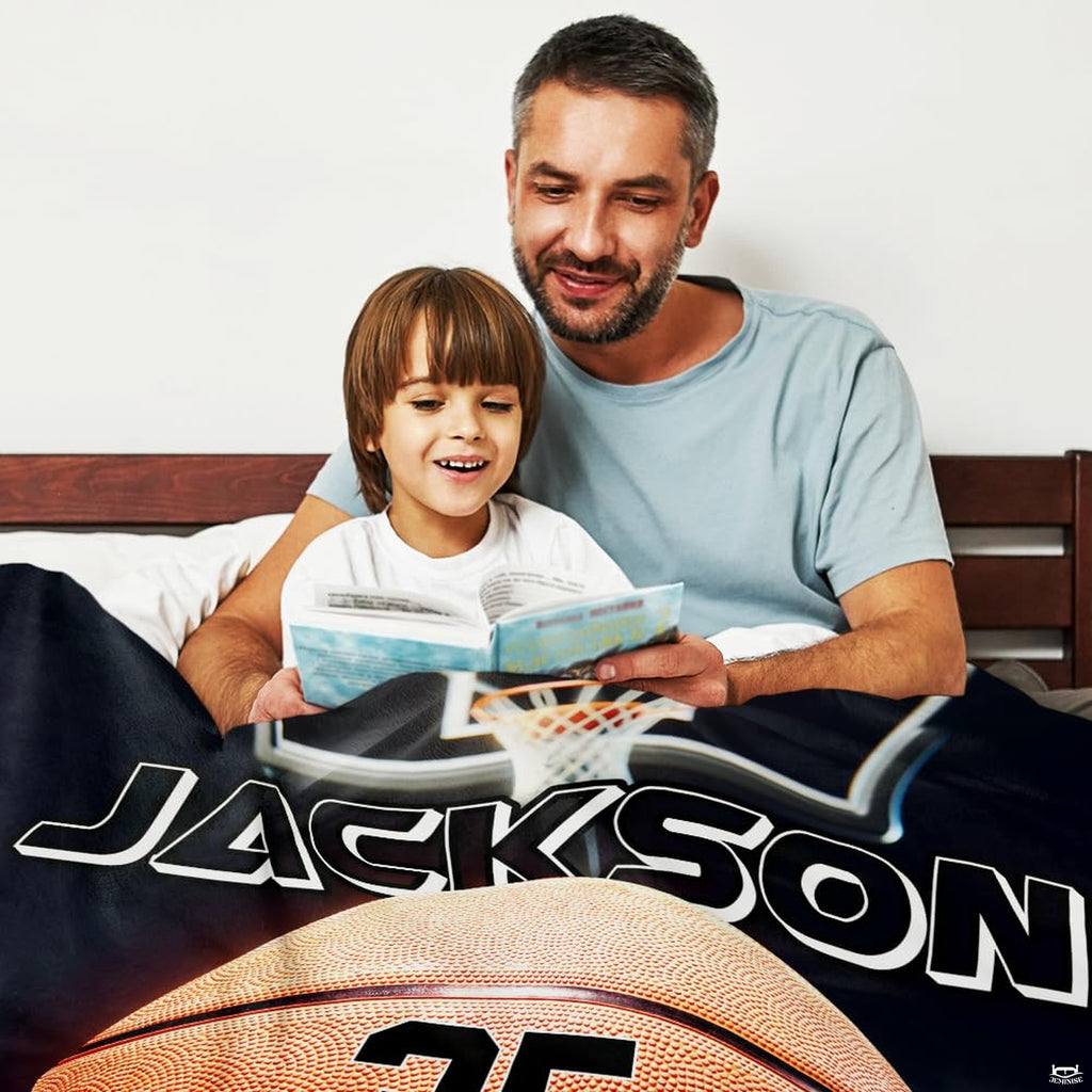 Close-up of vibrant orange athletic graphics and deep navy tones across basketball bedding set.