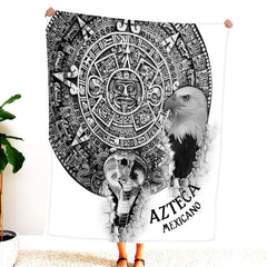 Person holding up black and white Aztec calendar blanket displaying eagle and serpent emerging from stone