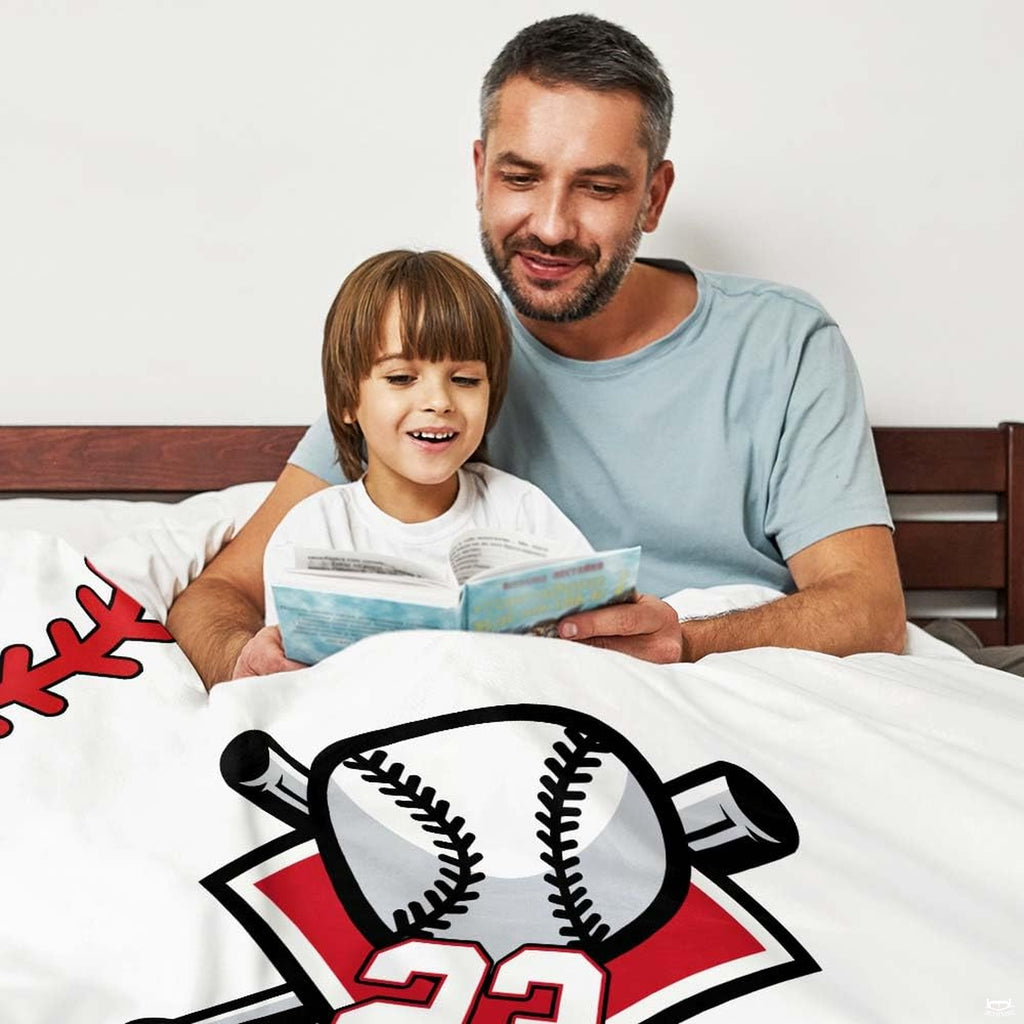 Angled side perspective of the fiery baseball blanket styling on top of bedroom furniture.