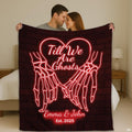 Gothic couple blanket held up in bedroom displaying red neon skeleton hands pinky promise design