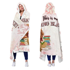 Perspective view showing drape and finished hem on the blush pink botanical throw blanket