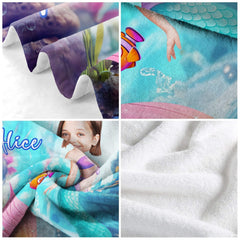 Detailed artwork view of mermaid tail and coral fish on blanket