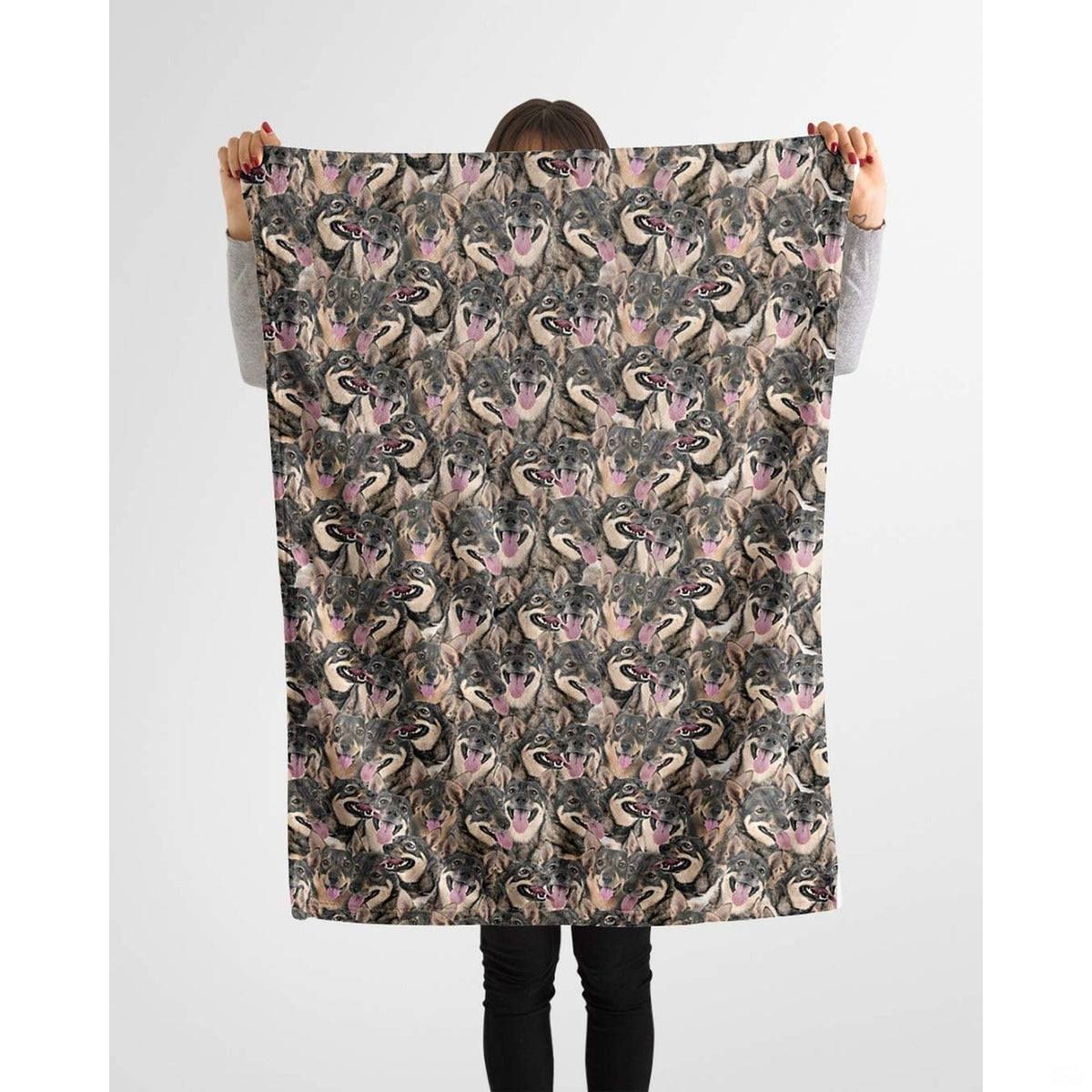 Swedish Vallhund collage blanket styled across a couch in a bright living room.