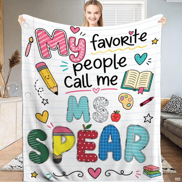 thematic accent throwback school theme bedding set with notebook backdrop and pencil art on bed.