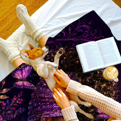 Devotional woman art throw blanket draped across a living room couch.