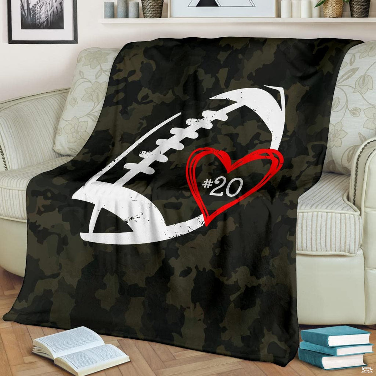 Camo football heart graphic gridiron blanket draped over sofa