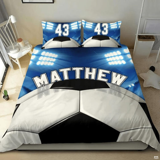 Vintage khaki and slate soccer cleats sports bedding featuring athletic soccer footwear and a ball on a bed