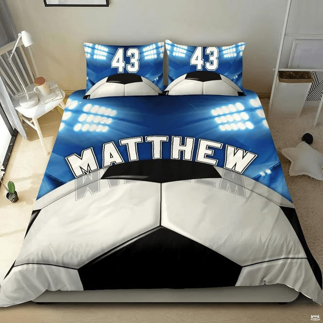 Vintage khaki and slate soccer cleats sports bedding featuring athletic soccer footwear and a ball on a bed