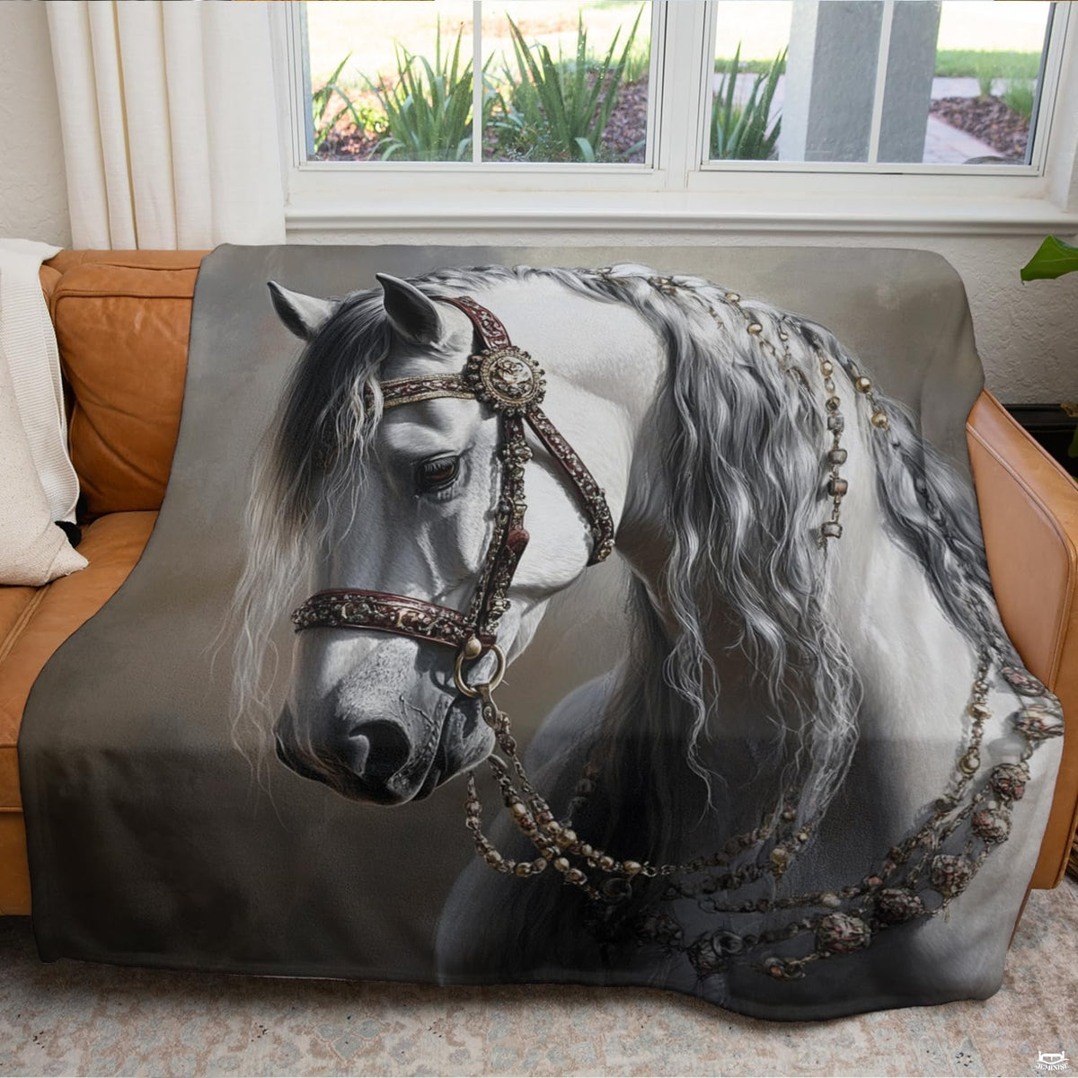 White stallion portrait print draped across modern indoor seating.