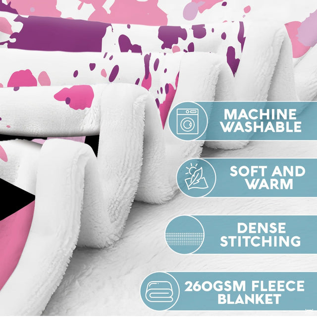 Flat layout of pink blanket featuring skeleton watching TV beside popcorn and caution tape