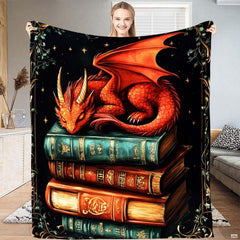 Sleeping red dragon on vintage book stack blanket front display