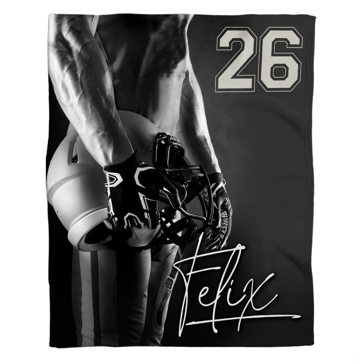 Woman holding open football player throw blanket showing monochrome gridiron athlete and helmet