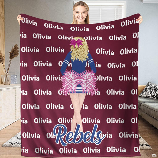 Display view held up by a person showing the cheerleader illustration with pink pom poms on maroon ground.