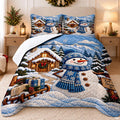 Holiday bedding featuring a snowman, rustic log cabin, sled, and snowy mountain peaks.