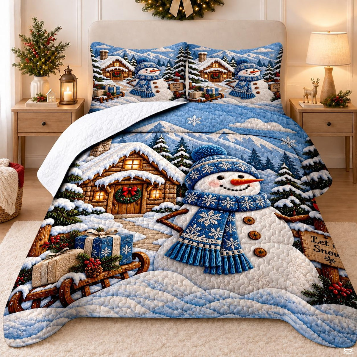 Holiday bedding featuring a snowman, rustic log cabin, sled, and snowy mountain peaks.
