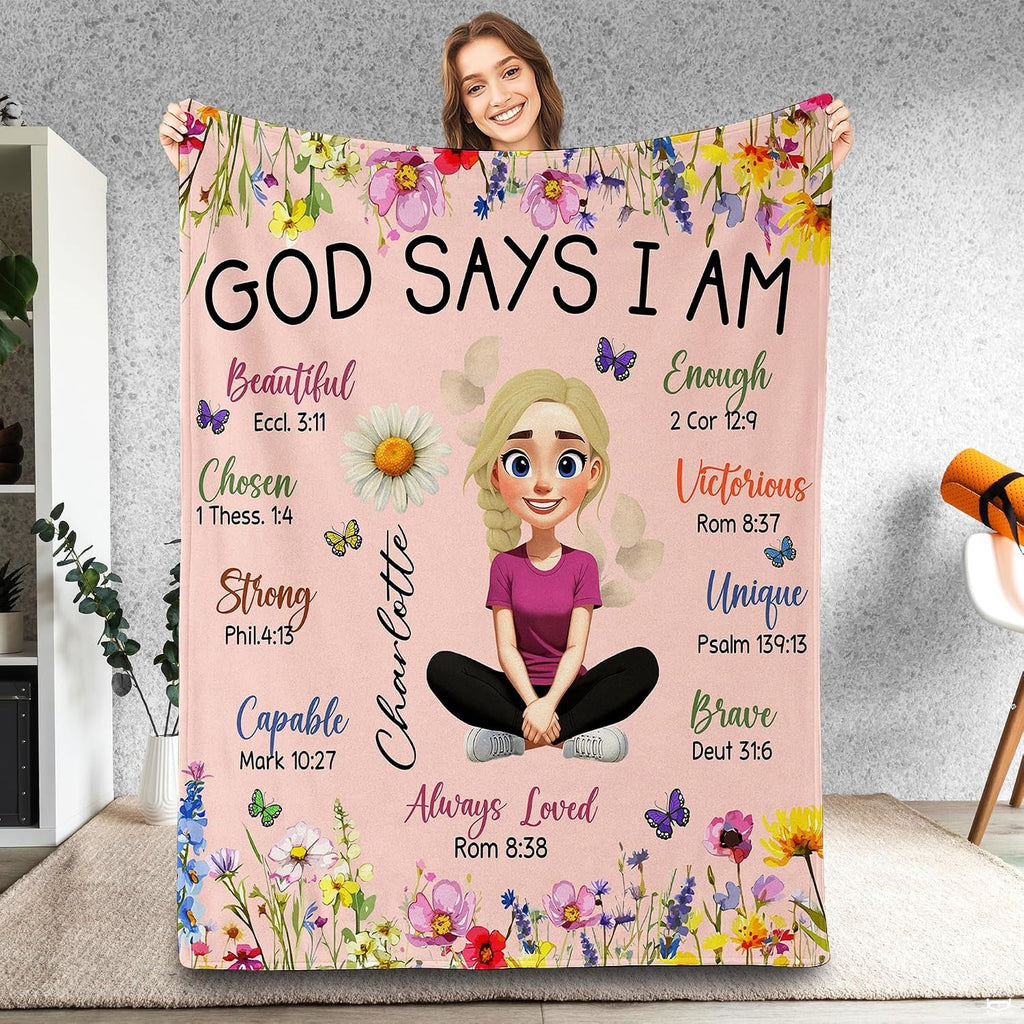 Scripture affirmation floral throw blanket held up showcasing illustrated girl and colorful wildflower borders