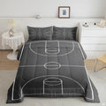 Monochrome soccer cleats and ball field bedding set displayed neatly on a bed in a sporty bedroom