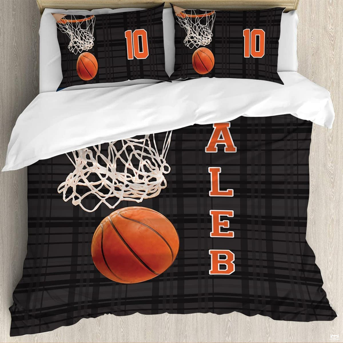 Close-up detail of textured basketball and orange hoop rim graphics on athletic sports bedding