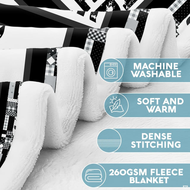 Close-up view of comical thematic accent thematic accent sketches and paw print details on monochrome bedding set.