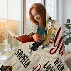 Custom reader girl throw blanket draped gracefully over a living room sofa creating a scholarly room accent.
