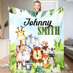 Woman holding open safari animals throw blanket showing tropical monstera leaves and baby creatures