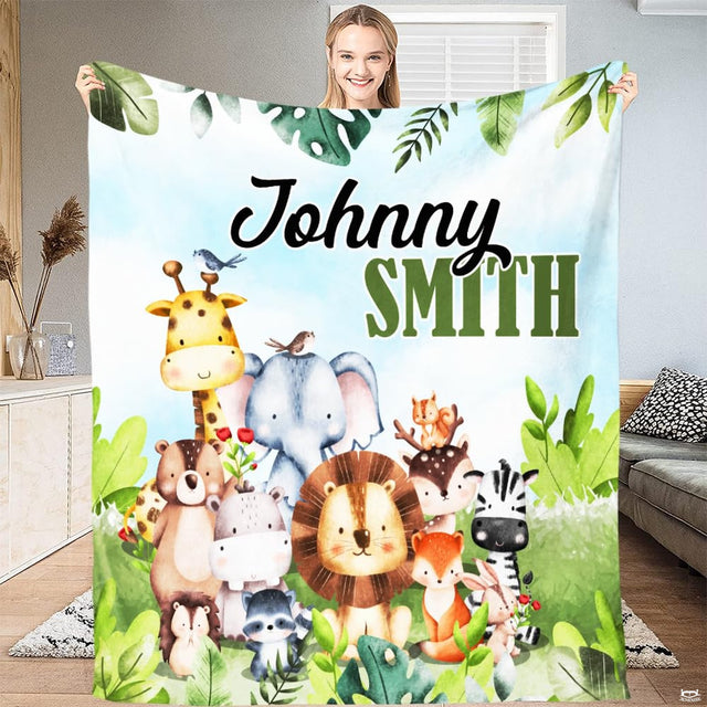 Woman holding open safari animals throw blanket showing tropical monstera leaves and baby creatures
