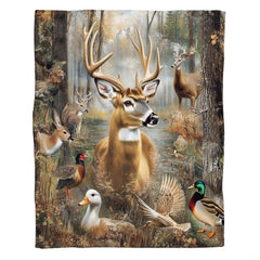 Woodland wildlife collage featuring a majestic whitetail buck deer and forest animals by a stream on a throw blanket
