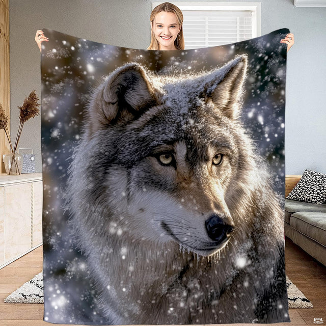 Majestic timber wolf portrait in falling winter snowfall with frosted fur and alert amber eyes.