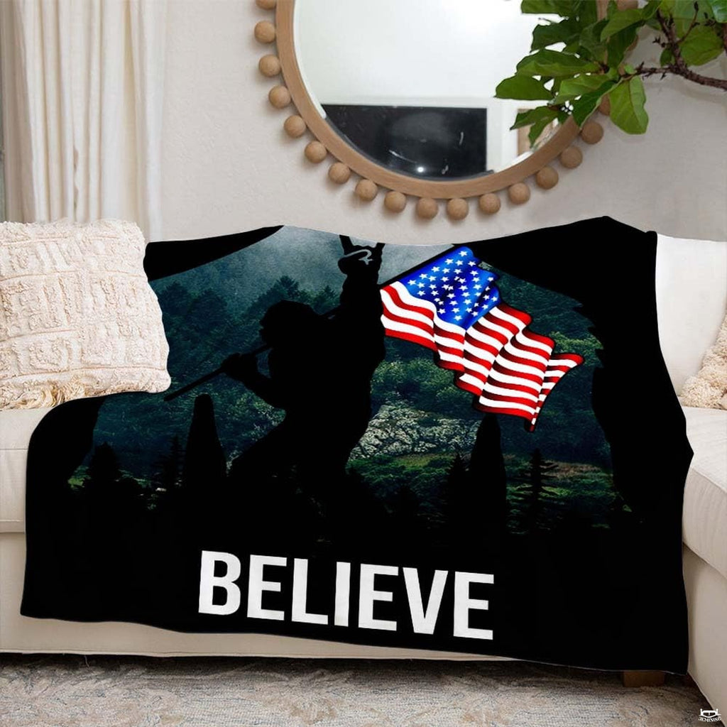Pillow shams with waving national banner and evergreen tree landscape graphic.