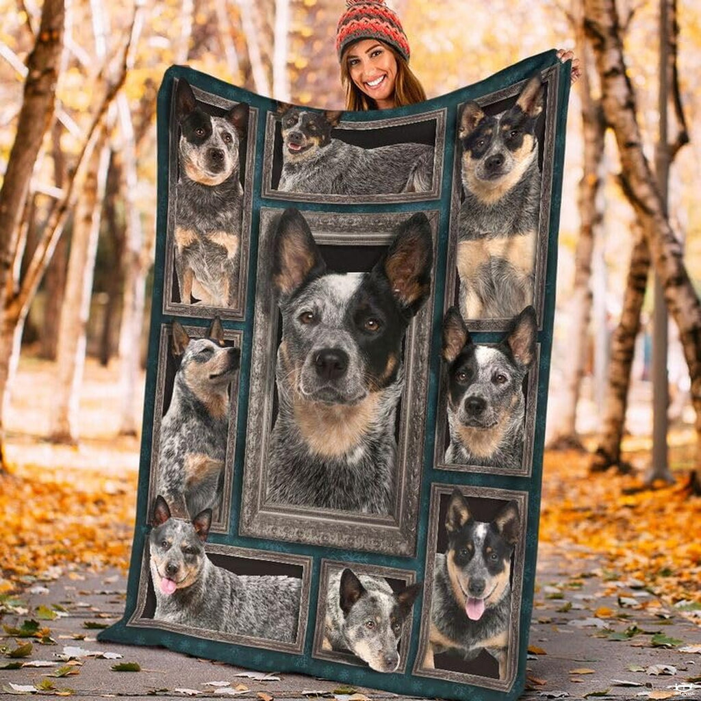 Model displaying the rectangular Australian Cattle Dog portrait blanket outdoors in an autumn park.