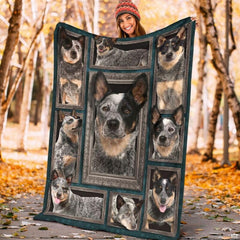 Model displaying the rectangular Australian Cattle Dog portrait blanket outdoors in an autumn park.