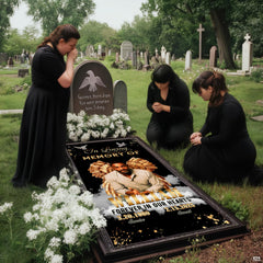 Memorial tribute textile display laid flat showing gilded wings on black