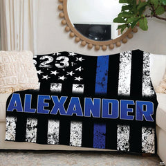 Vintage rustic flag print in black and slate hues with prominent blue centerpiece.