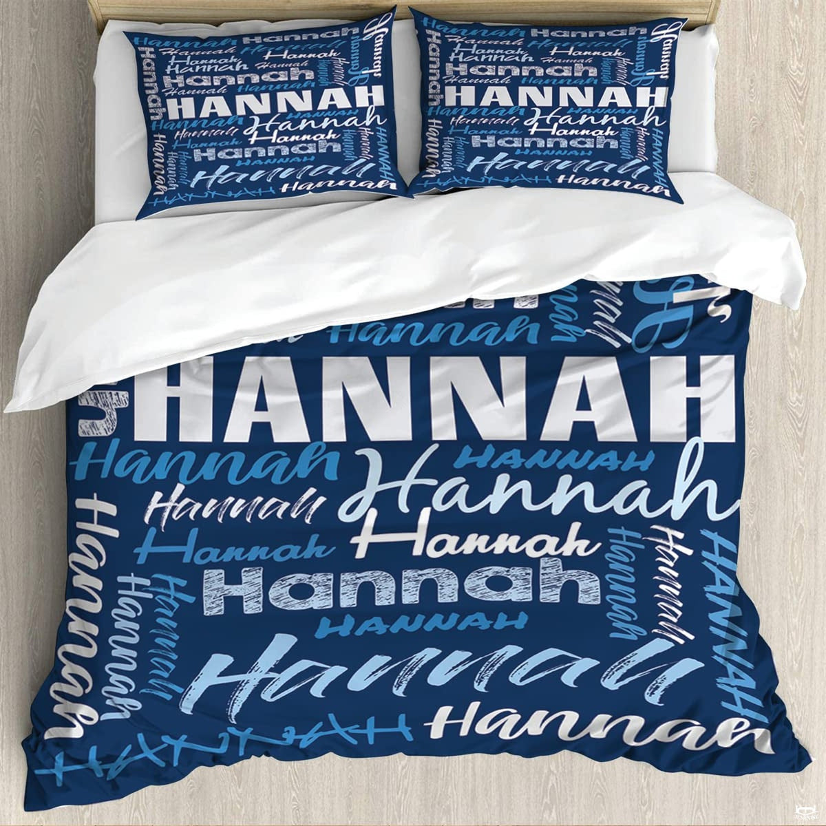 Blue typography bedding featuring an interlocking word collage of block and script lettering on navy backdrop