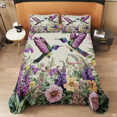 Overhead view of paired hummingbirds and colorful meadow artwork