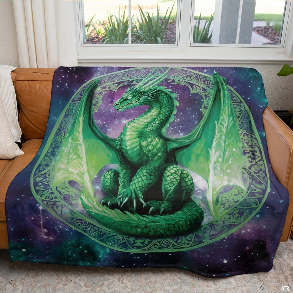 Emerald Celtic dragon throw blanket draped across a modern living room couch