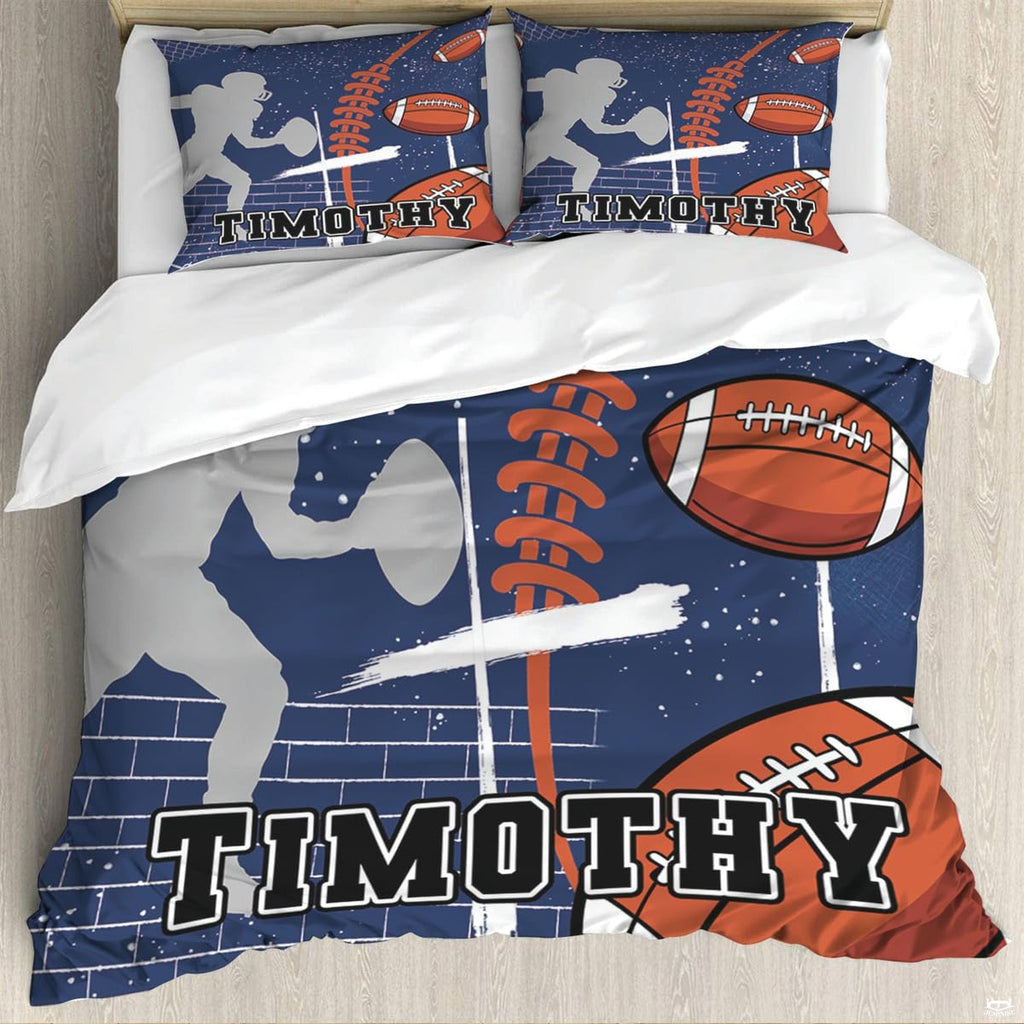Close-up perspective of football bedding detailing painted cross strokes, brick texture, and collegiate block lettering