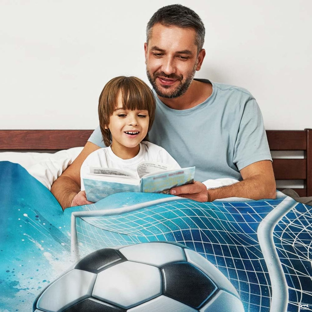 Bed setting with parent and child reading book beneath the blue watercolor soccer graphic.
