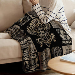 Bedroom setting featuring bold black, charcoal, and thematic accent cream graphic collage motif bedding decor.
