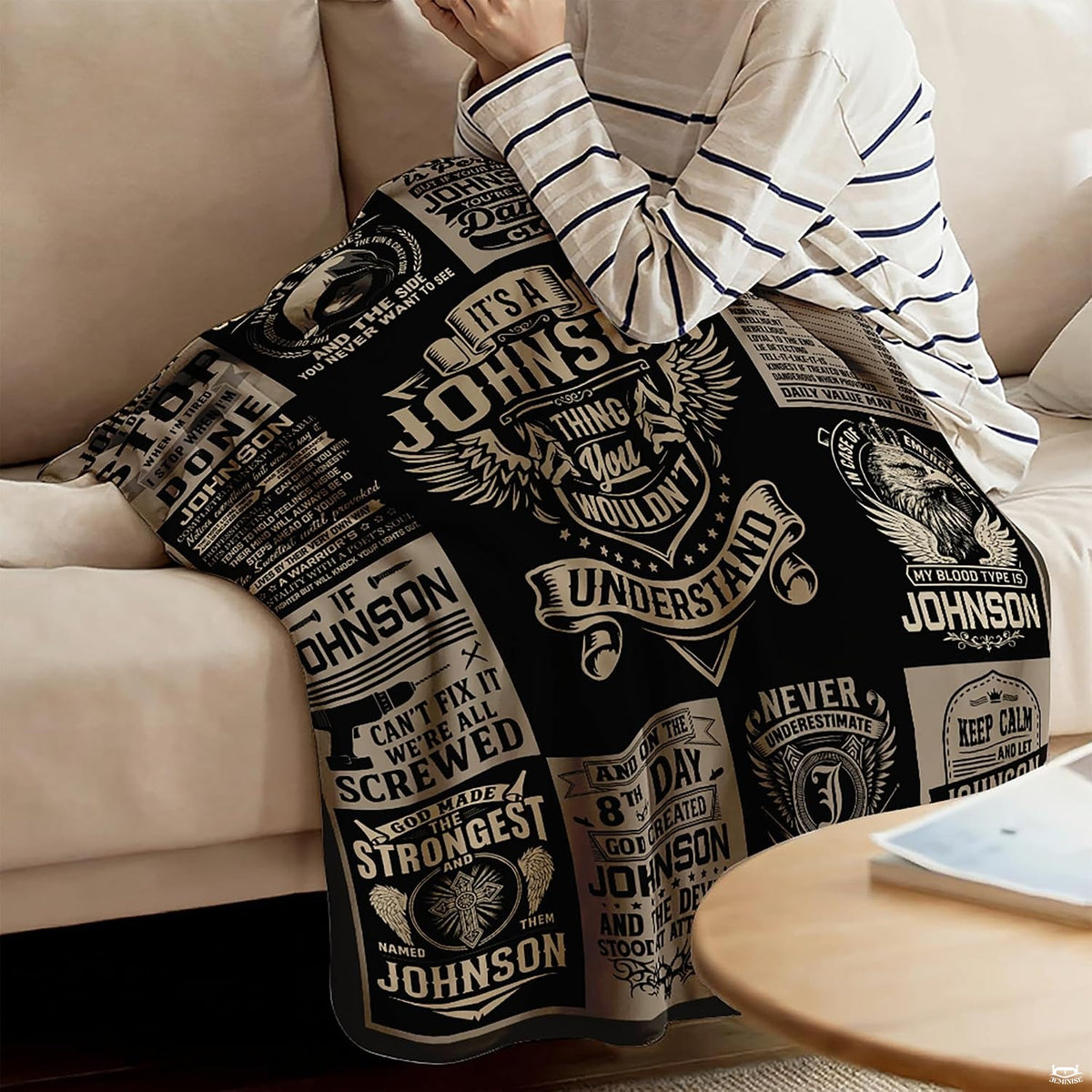 Bedroom setting featuring bold black, charcoal, and thematic accent cream graphic collage motif bedding decor.