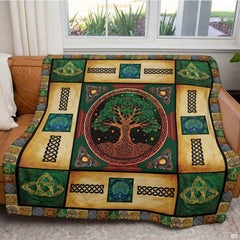 Detail shot of the celestial starry sky and ornate Celtic trinity knot illustration on the bedding set.