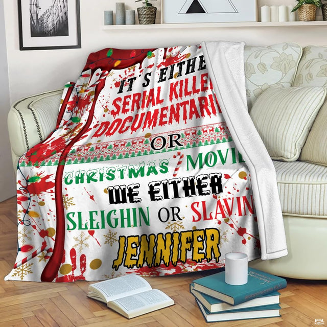 Flat view of Christmas true crime blanket featuring festive lights, candy canes, and blood splatters