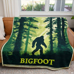 Sasquatch forest throw blanket view 5 highlighting evergreen trees, sunbeams, and rustic poster borders