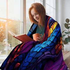 Dramatic winged dragon fantasy artwork displayed across bed with vivid kaleidoscope jewel tones.