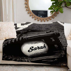 Monochrome baseball artwork blanket styled across modern couch sofa