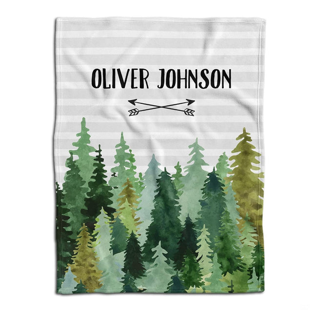 Flat lay view showing watercolor evergreen pine forest and crossed arrows beneath horizontal gray stripes.